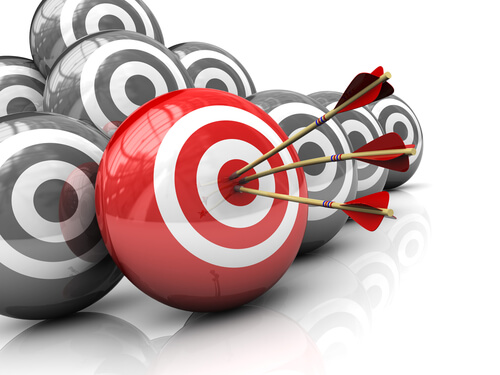 arrows hit bullseye on a red and white target